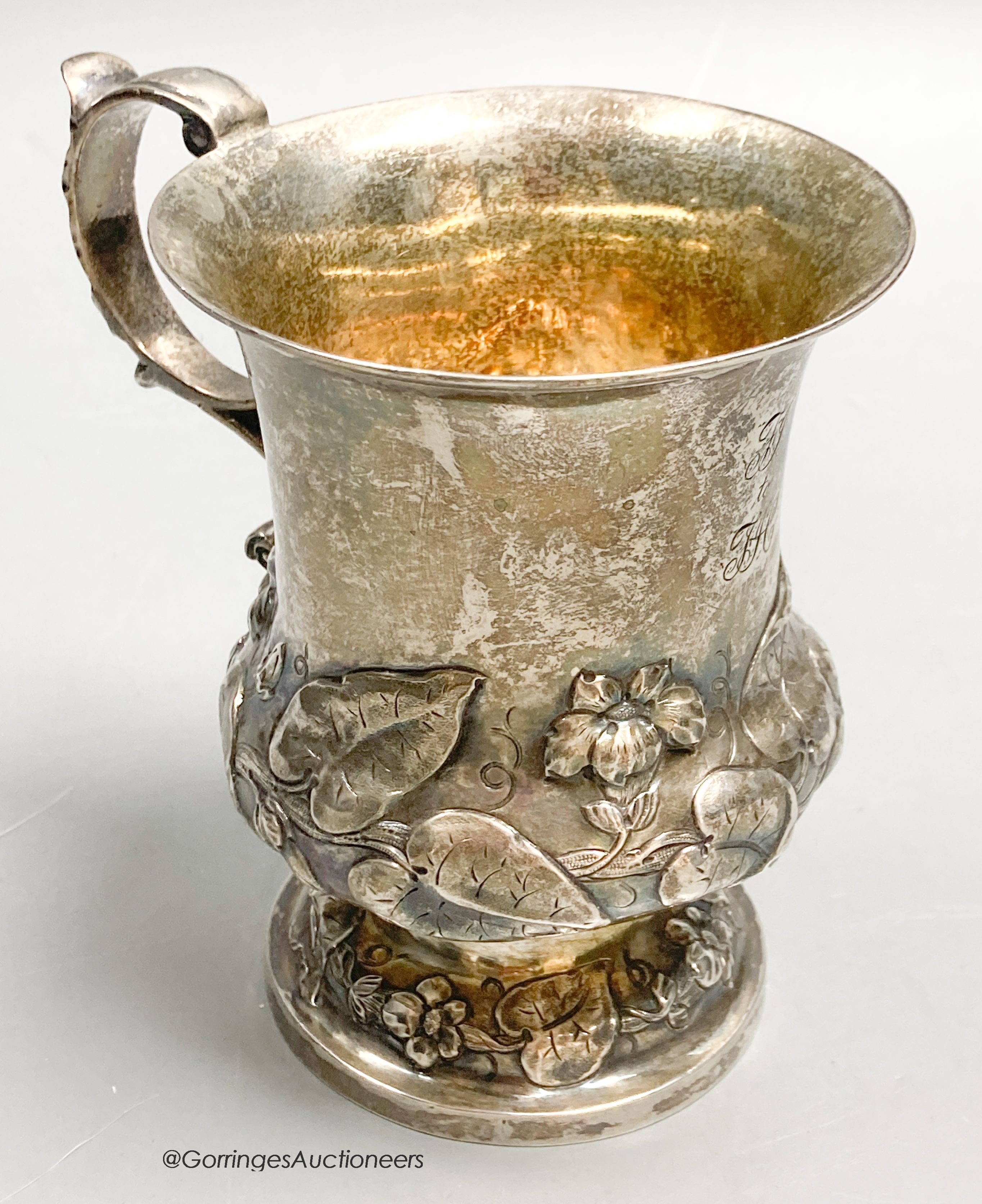 An early Victorian silver vase shaped christening mug, embossed with leaves, Brown & Somersall, London, 1839, 10.8cm, 5oz.